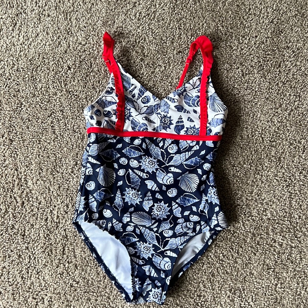 Tommy Bahama girls swim suit size 7. Cute ruffle detail. This is adorable on!